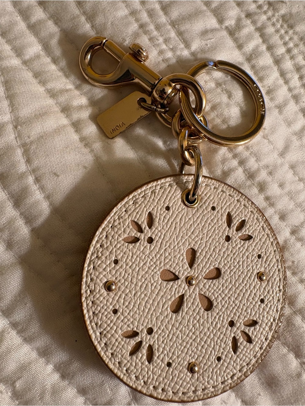 Coach Gold-Tone Hardware & Cream Pebble Leather Laser Cut Charm & Mirror